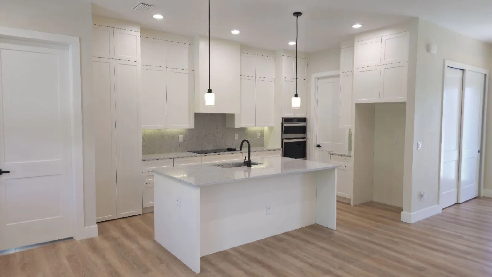 Kitchen interior with upgraded finishes in an EBM custom home